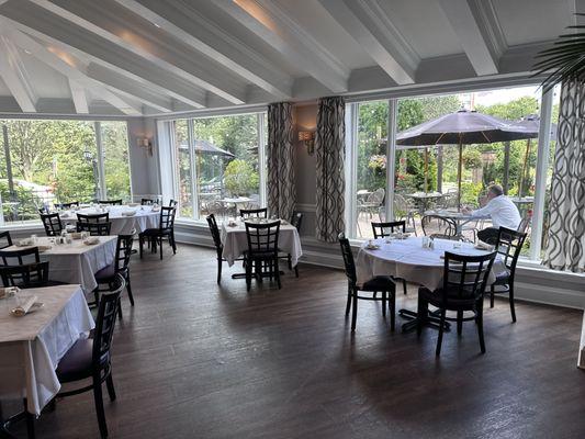 Large picture windows overlooking the Mill River park and our beautiful patio