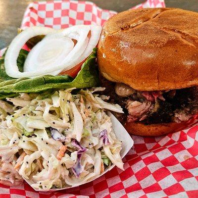 Brisket BBQ Sandwich served with a side of poppy seed coleslaw