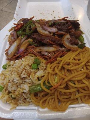 The lunch special portion for Mongolian beef.  The box is stuffed with food.