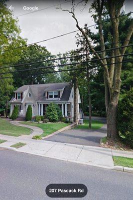 Before Pics of House before we owned it. Notice cracked Apron, Large Tree obstructing the driveway entrance (cut down by previous owner).