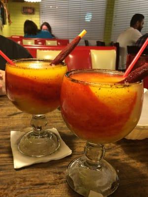 Mangonada w/ Tamarind stick. Chamoy too (red). Sweet, sour, spicy all in one