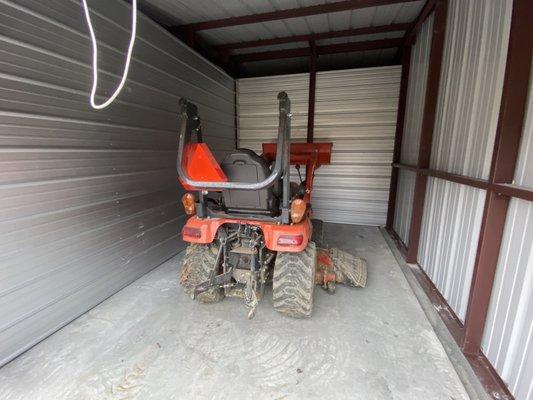 Tractor stored in storage unit