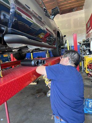 Roberto installing the muffler