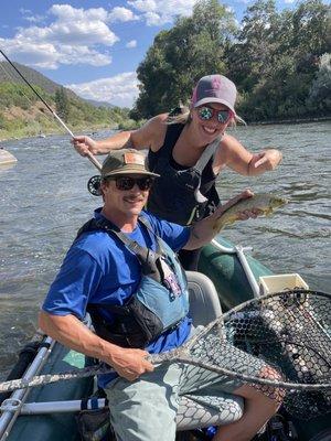 Fly fishing guide Will holding a trout for a guest