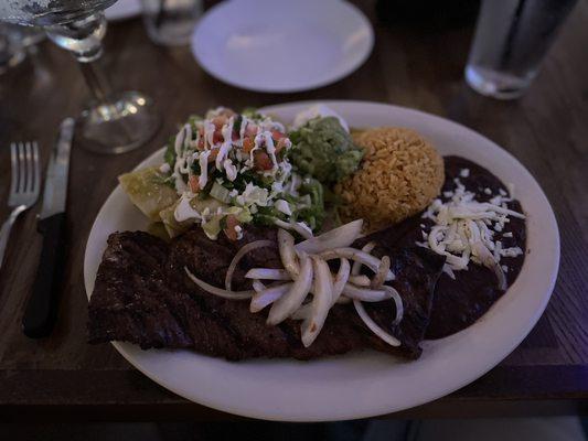 Bistek a la Tampiquena - marinaded skirt steak w two chicken Enchiladas, rice and beans - very good!