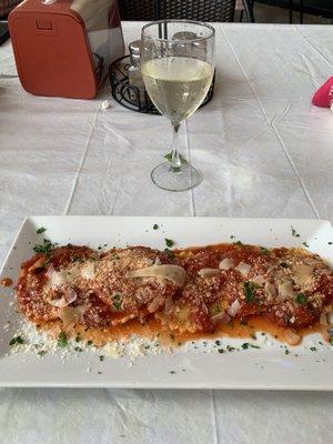 Ravioli with tomato sauce and Pinot G wine.