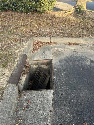 Wide open storm drain that you can fall into.