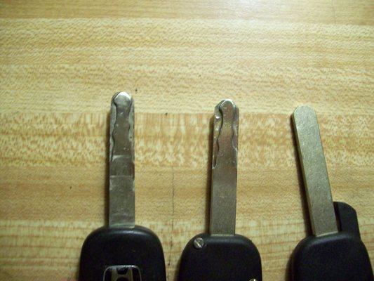 MY OLD KEY (LEFT) NEW KEY WITH TOOL MARKS AND ANOTHER KEY BLANK