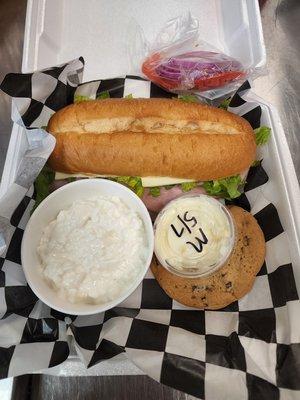 Sub sandwich field meal with cottage cheese and cookies