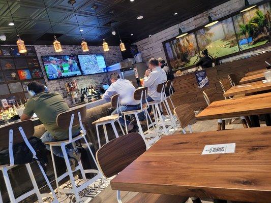 Comfy bar stools, a wide bar and 7 tables, so plenty of room to relax.