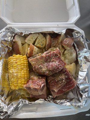 Lou Lou's Special 
 Smoke Neckbones W/Garlic Potatoes & Garlic corn