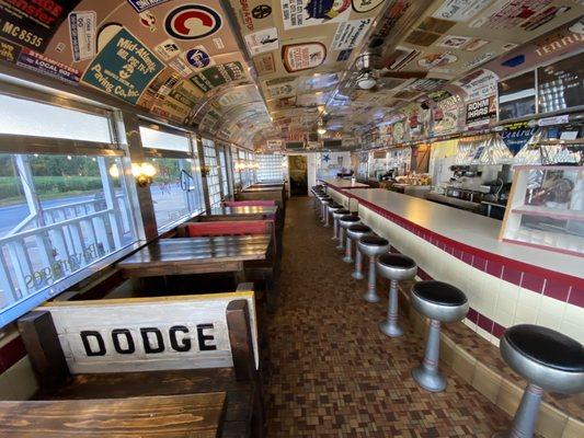 Interior ceiling covered in road themed stickers and plaques.