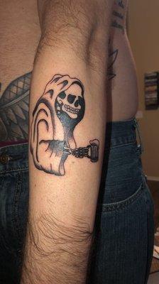 Grim Reaper holding beer mug