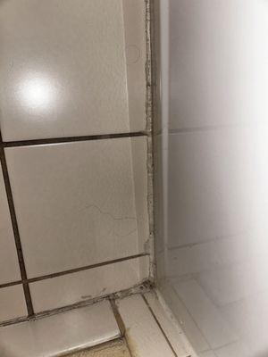 Floor next to toilet