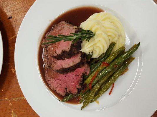 Hand carved beef tenderloin over a root vegetable puree- red wine reduction