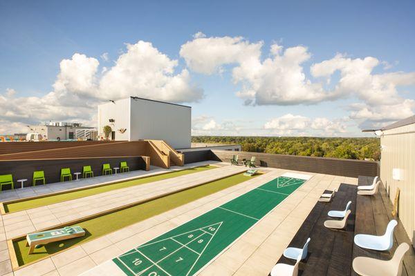 Roof top corn hole and shuffle board