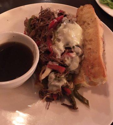 Brisket Philly sandwich. Photo doesn't do it justice. Brisket with peppers, onions, and provolone cheese served with side of au jus. Yum!