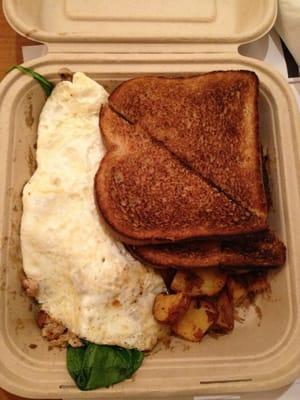 Spinach and turkey egg white omelette with wheat toast and potatoes $6.99 + $1.00 for egg whites