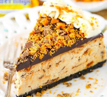 This BUTTERFINGER CHEESECAKE is a rich, thick and creamy peanut butter cheesecake with lots of chopped butterfingers.