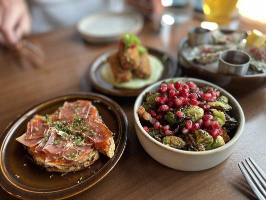 Tomato Conserva Toast with the addition of Iberico ham (left). Brussel Sprouts (right).