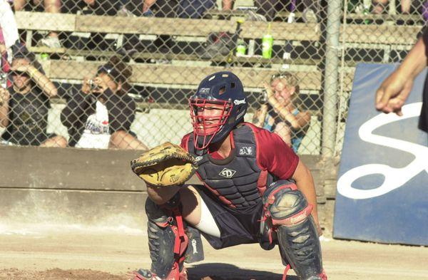 A photo of me Jenny Topping catching one summer for the USA Softball team.