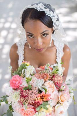 Coral and blush bouquet for a rose garden wedding.