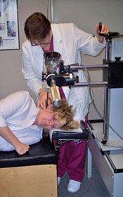 Dr. Beth Blakely at work with a patient | Carmichael Chiropractor