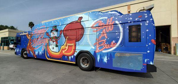 City of Norwalk Stuff-A-Bus charity full transit bus wrap. Happy Holidays!