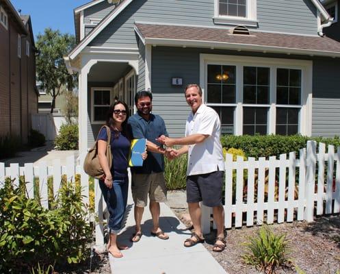 Bob handing the happy homeowners the keys to the house! 
 http://www.inspiragroup.com/