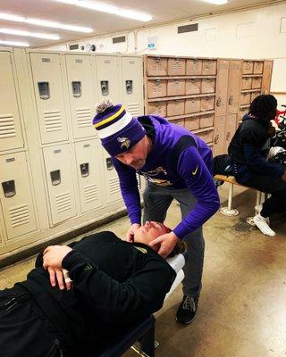 Adjusting Madison High School Football Players at Wednesday night injury prevention clinic