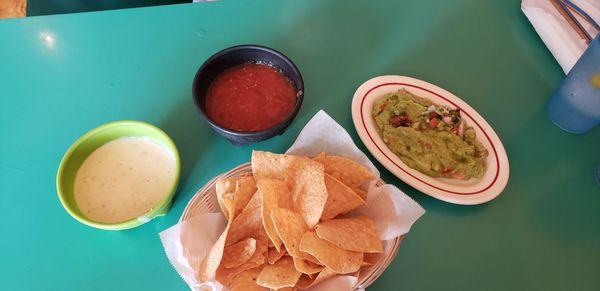 Chips, salsa, guacamole, and queso.