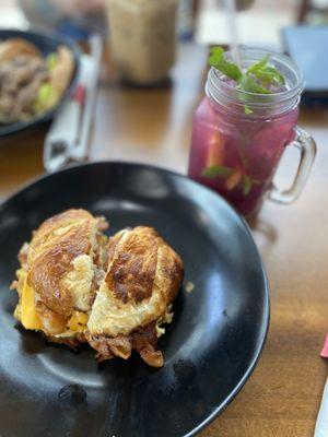 Bacon egg & cheese croissant & wildberry basil lemonade