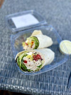 Santorini Wrap - Mixed Greens, Kalamata Olives, Bell Peppers, Onions, Grape Tomatoes, Banana Peppers, Chickpeas, Cucumber, Feta & Chicken.