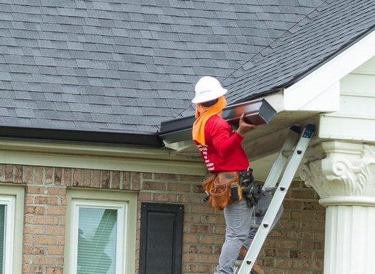 Installing 6 In. Gutters to a beautiful home in the area.