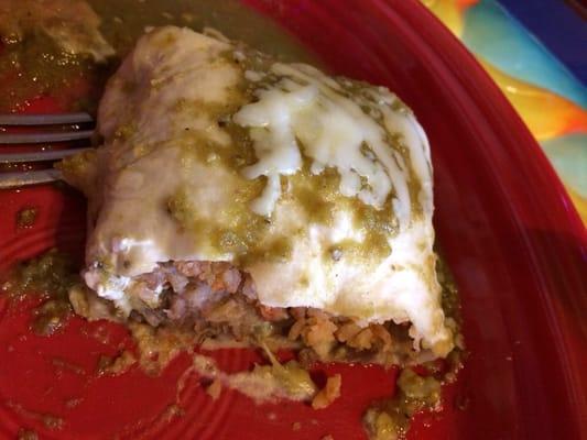 Burrito with beef (not taco meat) and spicy green chili sauce.