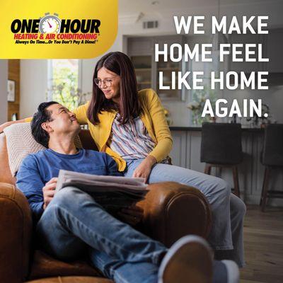 Man and woman sitting in brown leather chair looking and smiling at each other with overlay text that says We make home feel ...