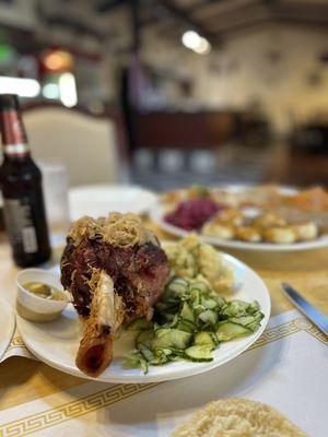 Pork shank cucumber salad and German potato salad