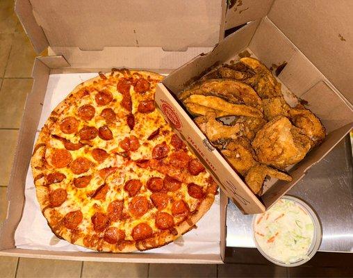 Every day special - Family Feast - 1 topping pizza, 8 pc. GOOD fried chicken, tasty coleslaw and Jo Jos. Great value $34. 95.