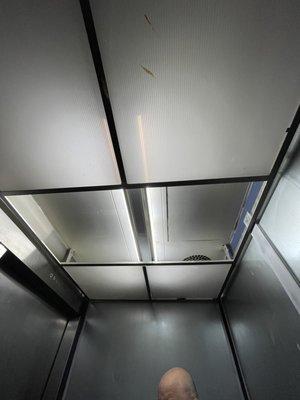 Missing ceiling tiles in the elevator