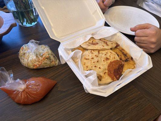 Pupusas, salsa roja and curtidos (both salsa and curtido come with the order of any pupusa.