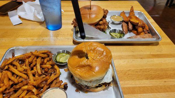 Bottom tray is the big dog burger with Cajun fries, top tray is the hot honey chicken sandwich with potato wedges.