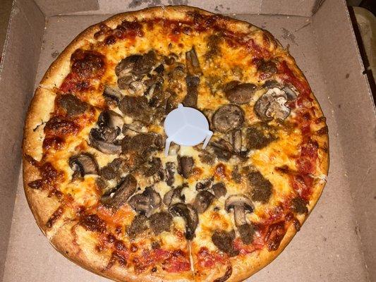 Small mushroom and meatball pizza