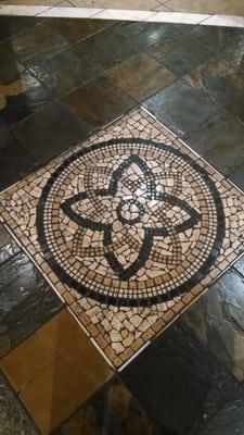 Nice tile pattern inlaid in the floor.