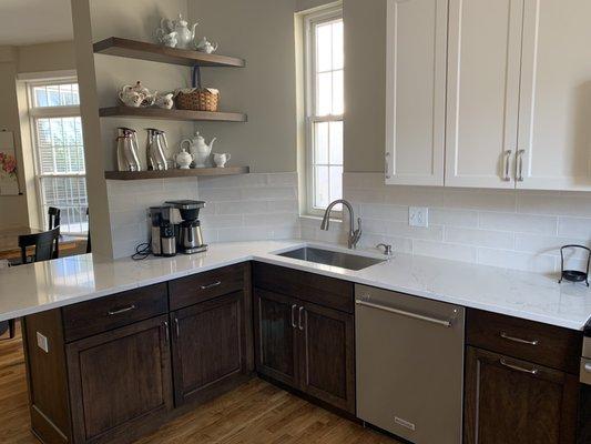 Custom cut floating shelves and a tight and perfect cabinet fit in the corner