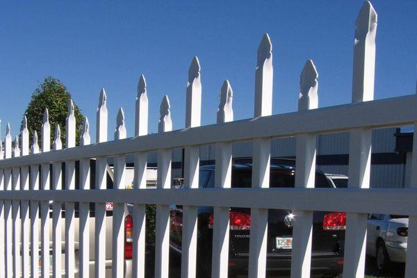 Decorative aluminum fence with security finials.