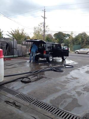 3 guys cleaning the interior.