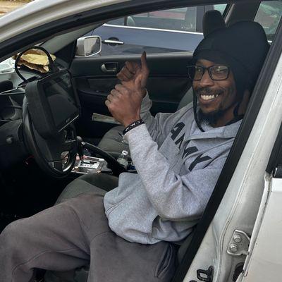 This guy is so glad he got his car jumpstarted and a key made for it!