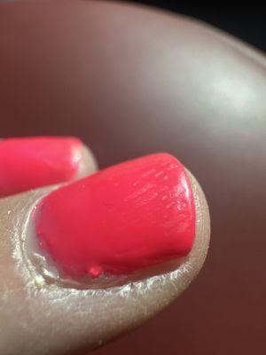 You can see the brush lines in my polish with a extra lump of polish on the side