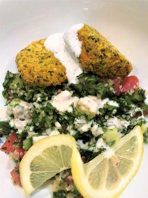 Baked Middle Eastern Style Falafel with Tabbouleh Salad and Dill Yogurt Sauce.