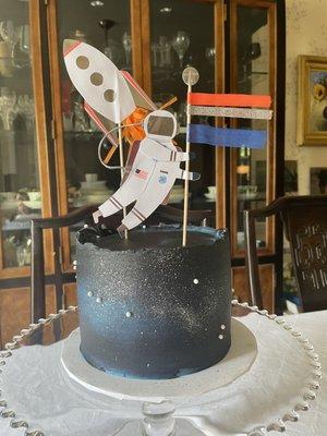 They nailed the galaxy icing with the addition of little pearls. Toppers added by me.